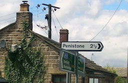 A street sign for Peniston